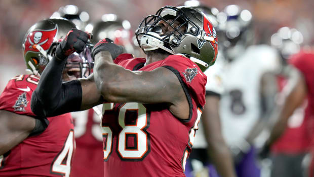 Buccaneers linebacker Shaquil Barrett celebrates after sacking  Ravens quarterback Lamar Jackson.